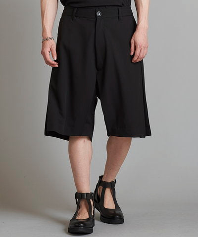 Inverted pleated half trousers